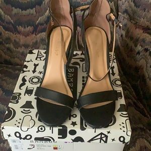 Bamboo black, strapped heels. Only worn once.